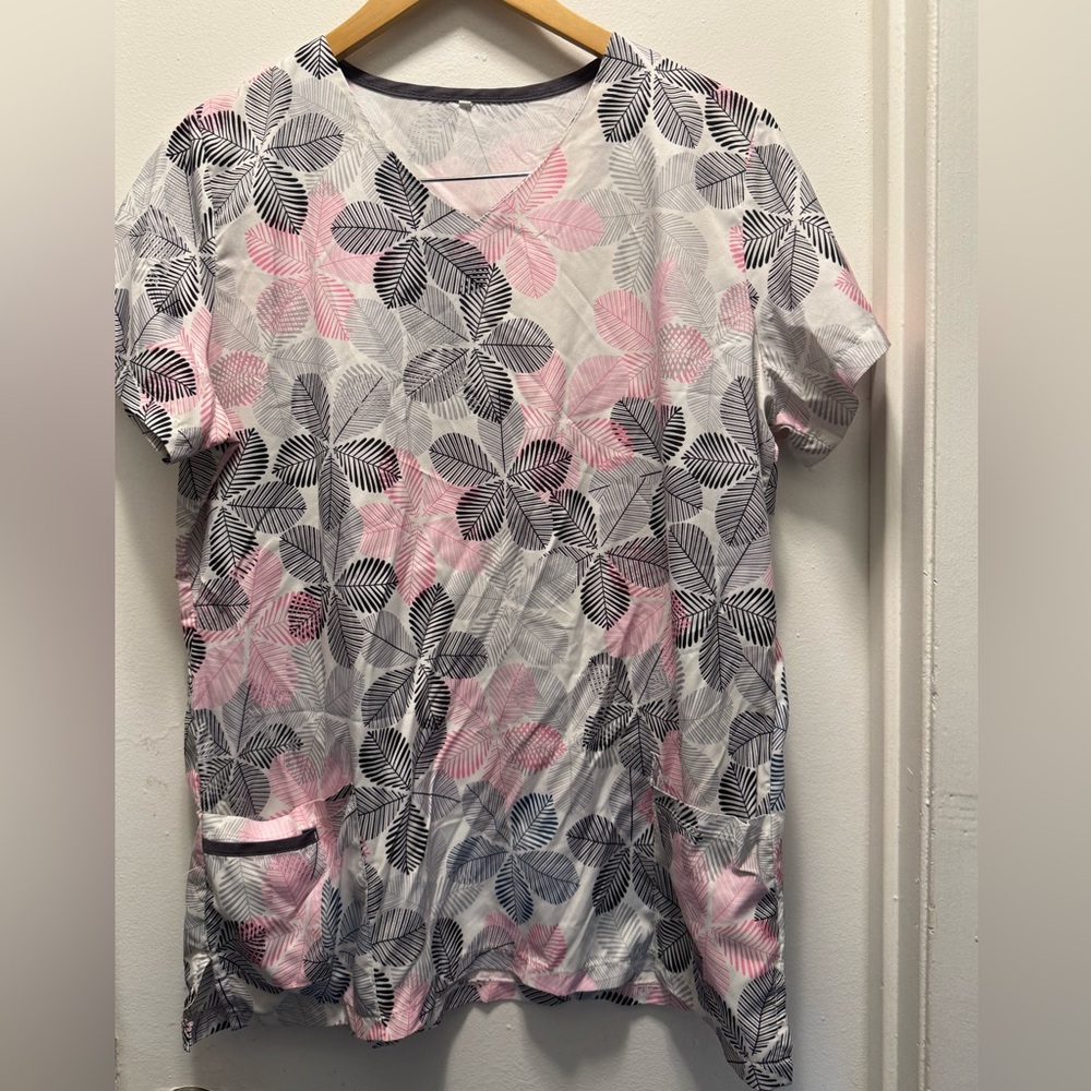 Scrub top. Size XL fits like a Large. Very thin material. Good spring top.